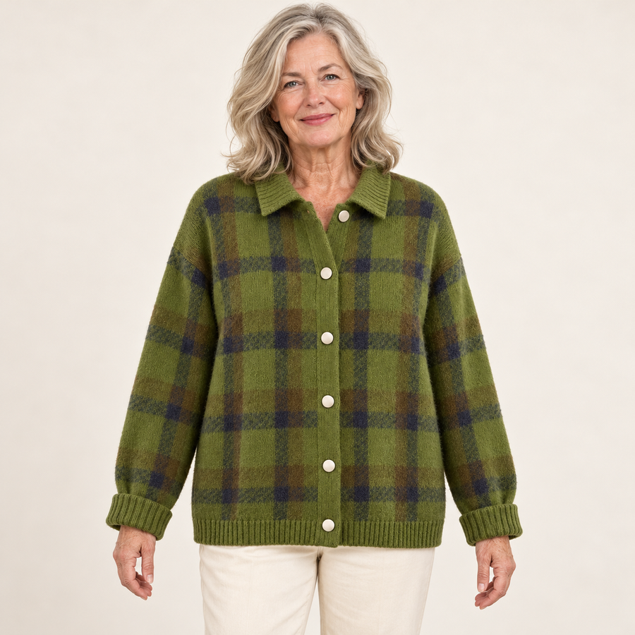 AI-generated styling illustration: green Alma knit on a female model in her early sixties; garment size not verified.