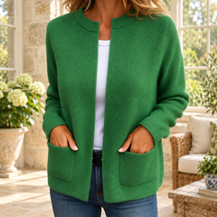 Kerry Zip-Up Knit Cardigan in Green, shown in an Irish country-house conservatory