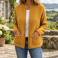 Kerry Zip-Up Knit Cardigan in Yellow, shown in an Irish stone terrace setting
